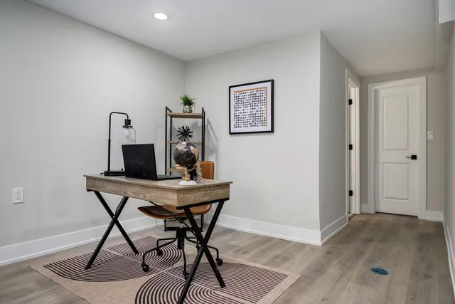 a workspace with furniture and wooden floor
