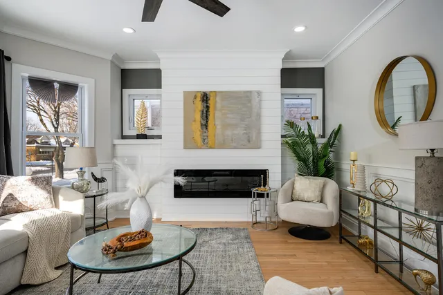 a living room with furniture and a fireplace