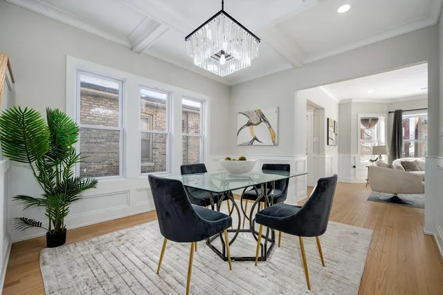 a view of a livingroom with furniture window and wooden floor