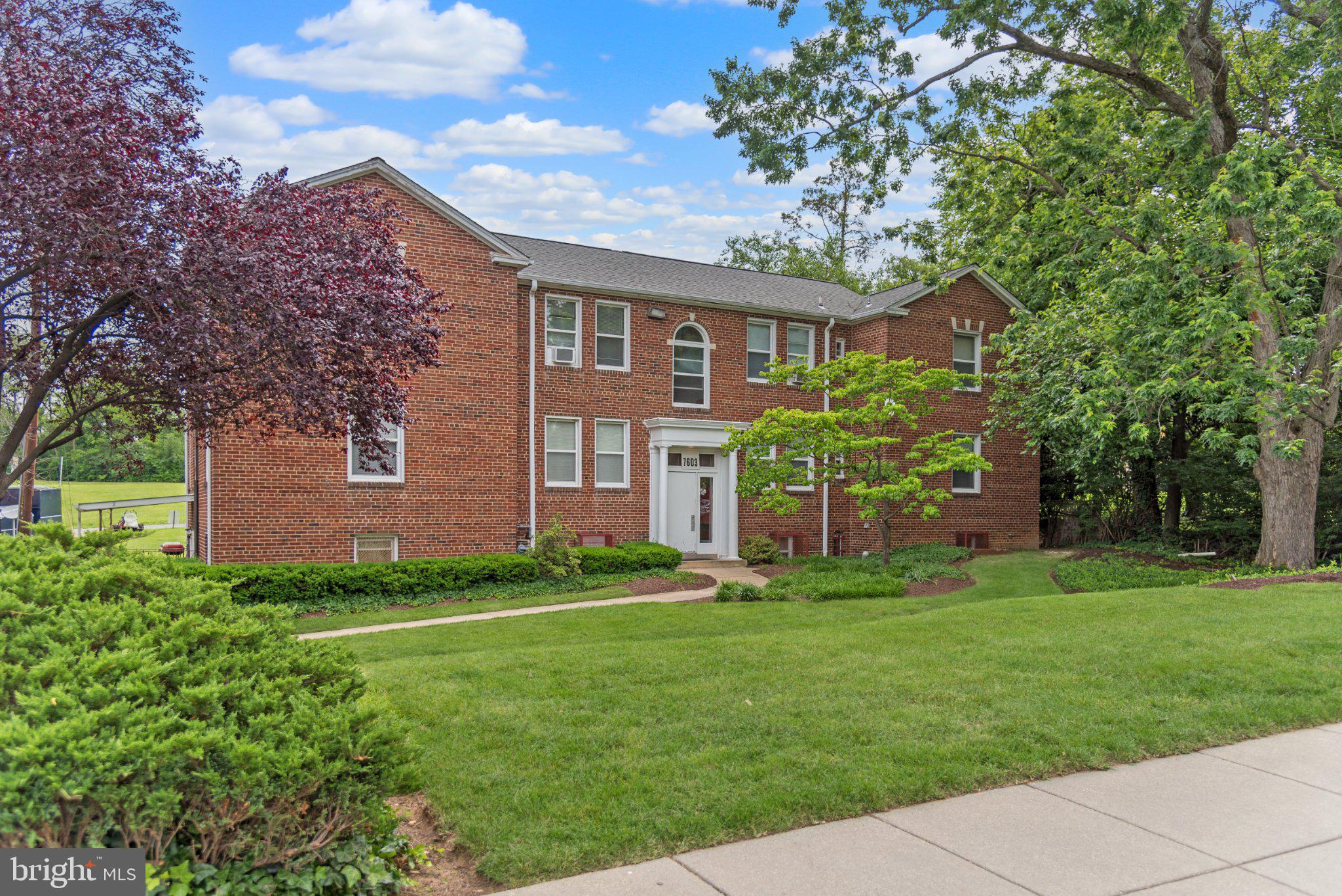 7607 Eastern Avenue Northwest, Unit 102 Silver Spring, MD 20912 - Photo 50 of 51 Charming brick residence in lush surroundings.