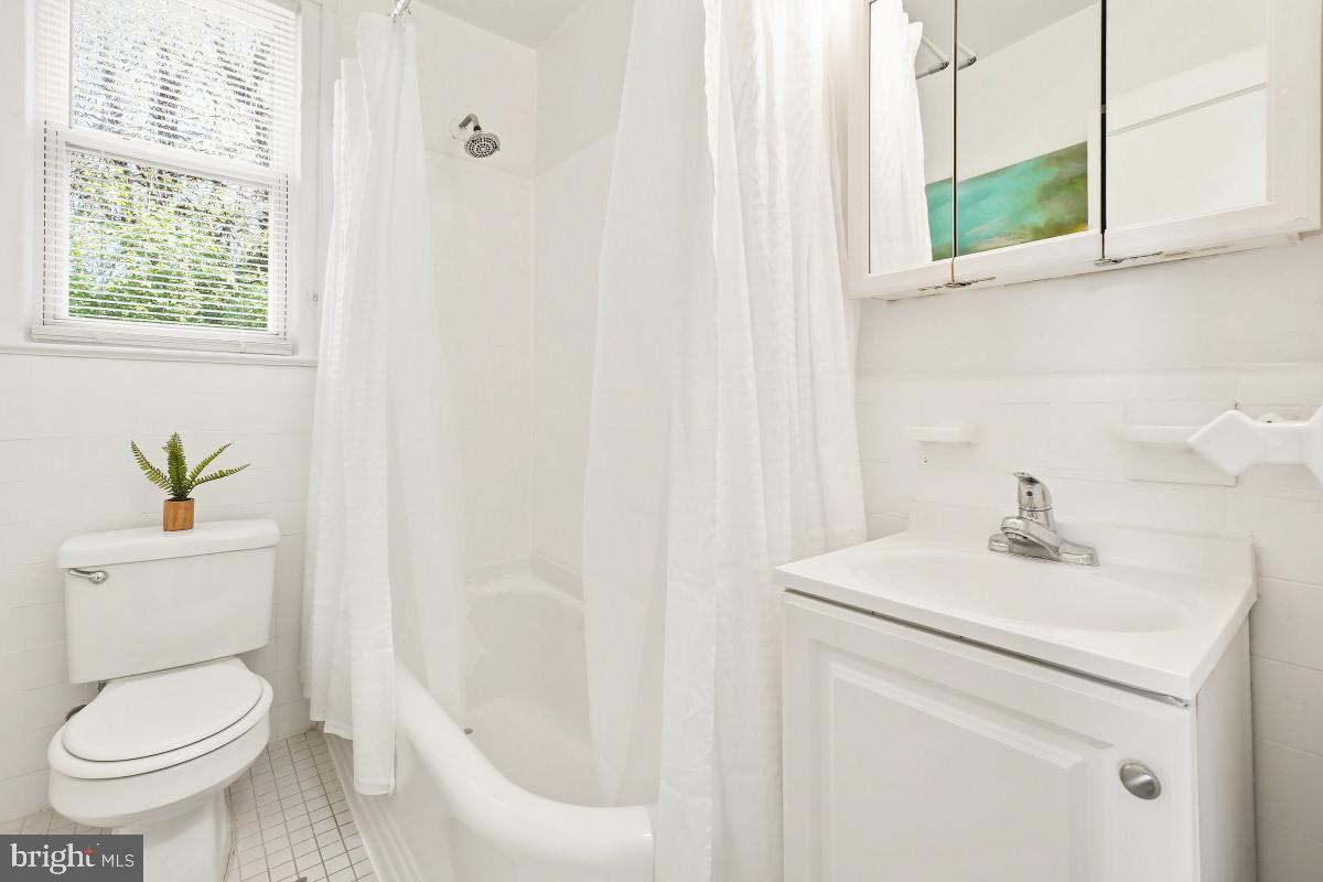 7607 Eastern Avenue Northwest, Unit 102 Silver Spring, MD 20912 - Photo 10 of 51 Updated Classic Bathroom