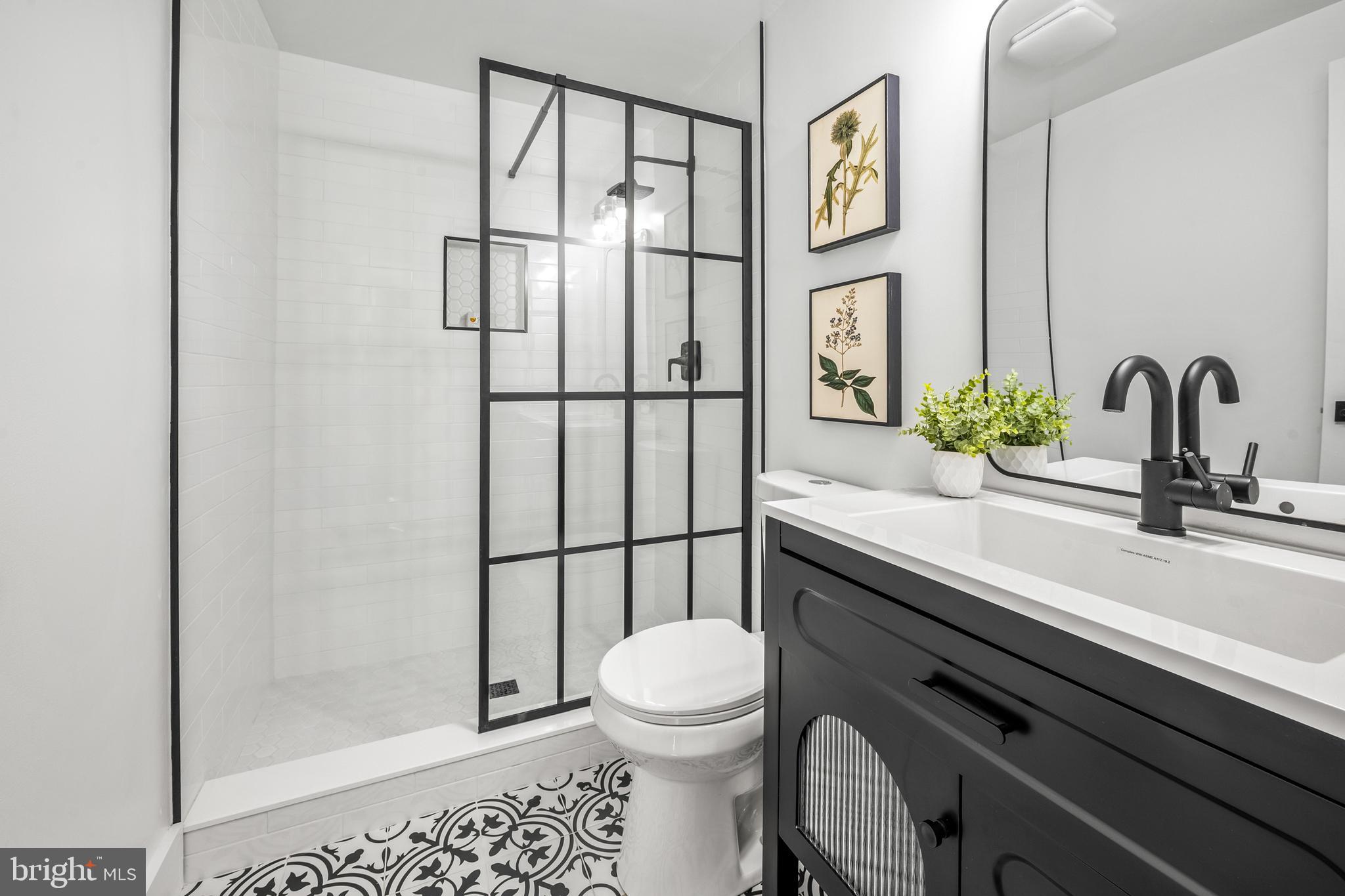 1359 Rock Chapel Road Herndon, VA 20170 - Photo 11 of 36 a bathroom with a sink a toilet and shower