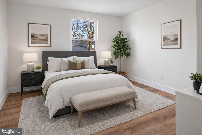 1359 Rock Chapel Road Herndon, VA 20170 - Photo 13 of 36 a bedroom with a bed and a potted plant