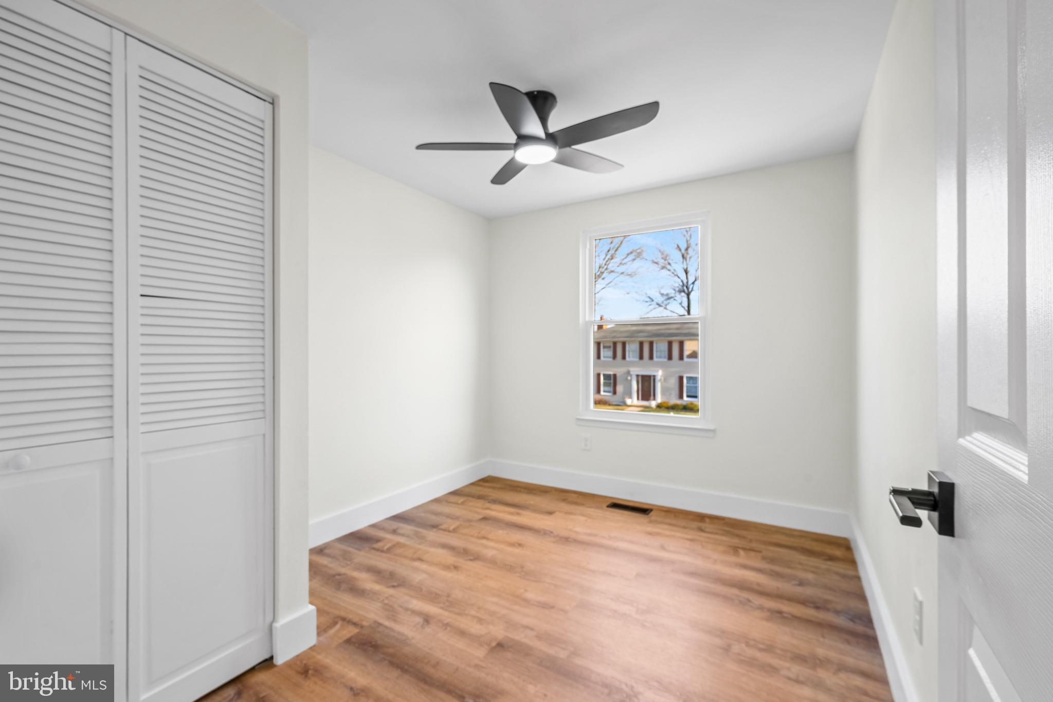 1359 Rock Chapel Road Herndon, VA 20170 - Photo 16 of 36 wooden floor in an empty room with a window