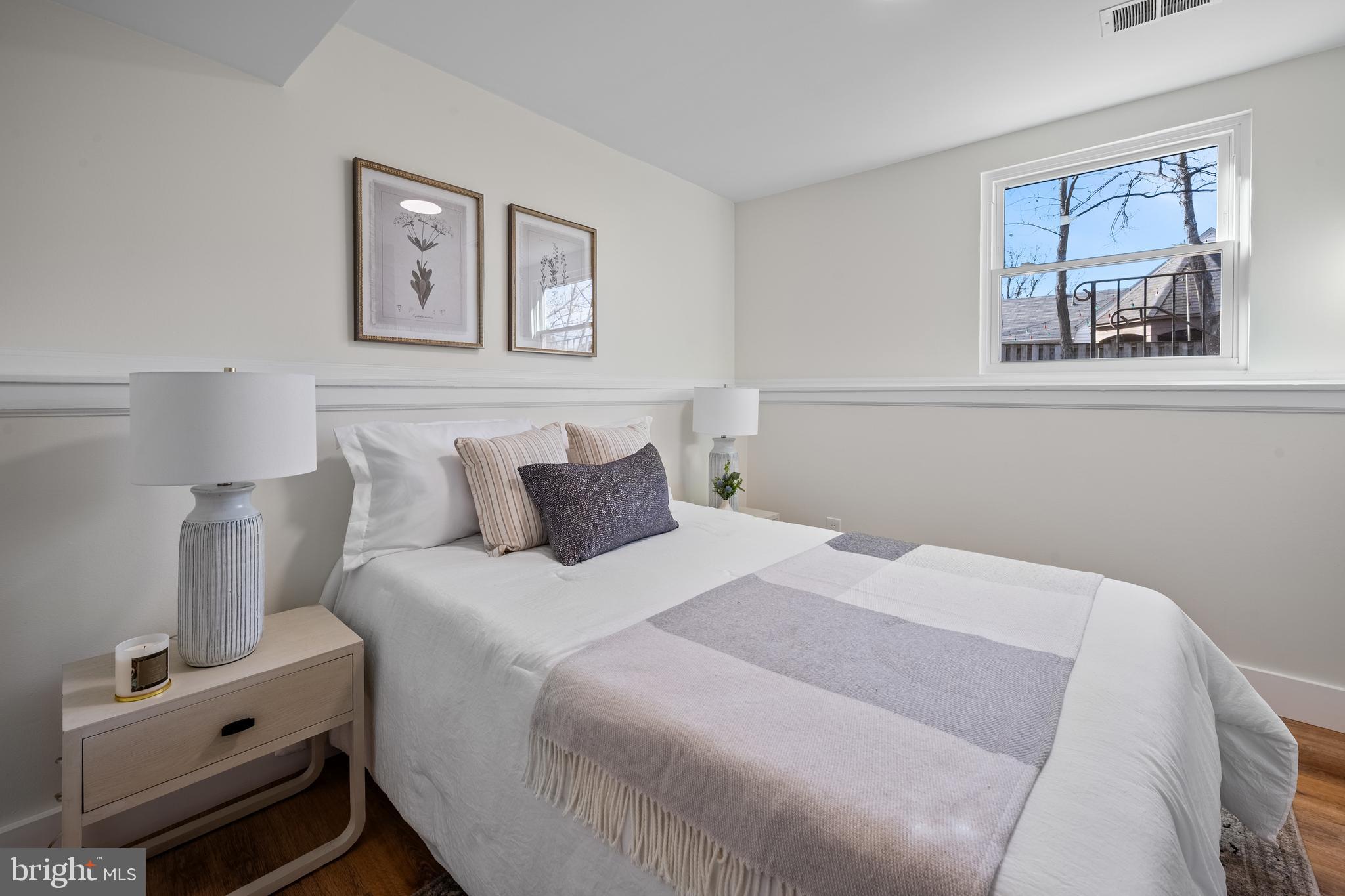 1359 Rock Chapel Road Herndon, VA 20170 - Photo 20 of 36 a bedroom with bed and wooden floor