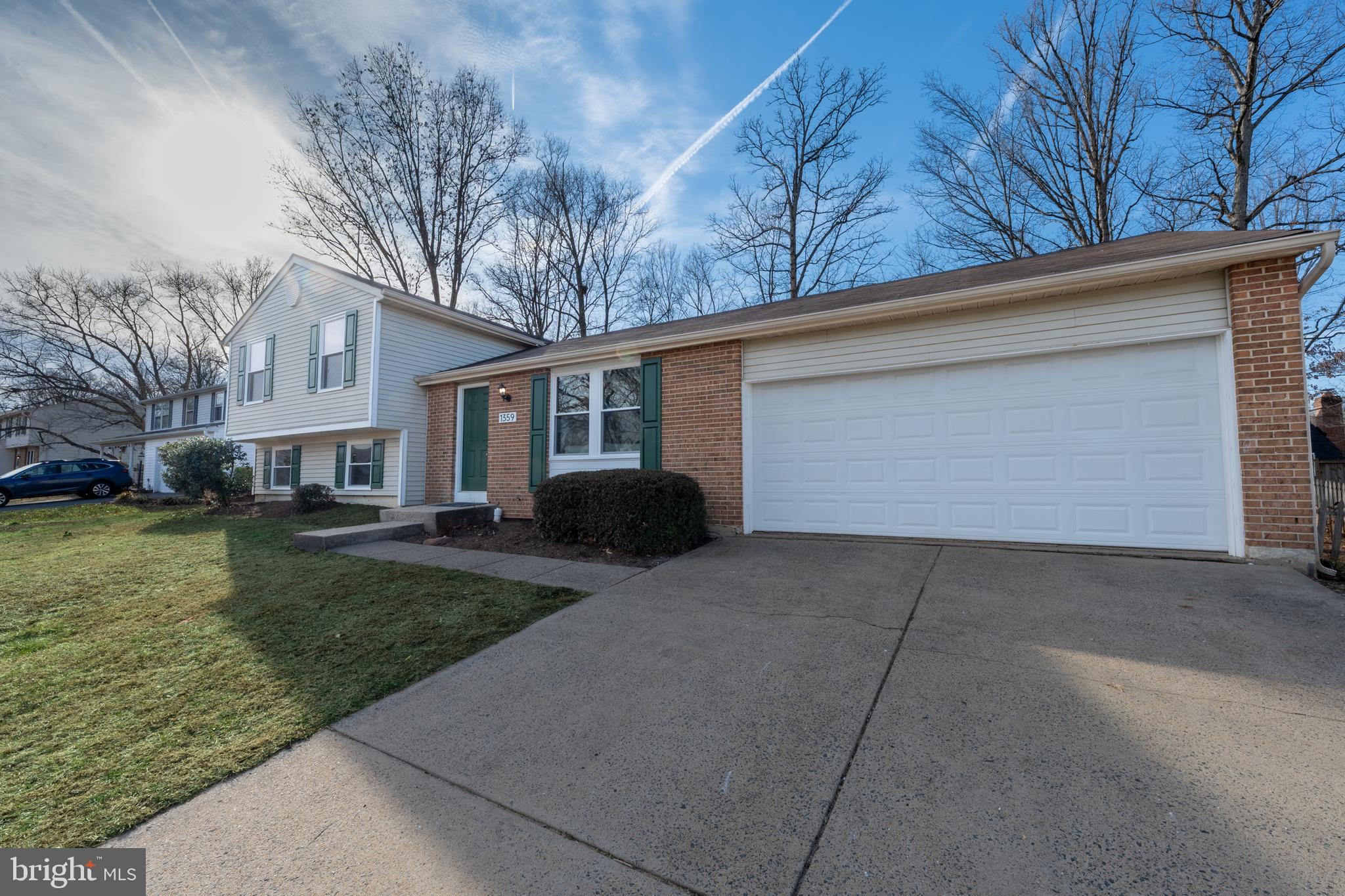 1359 Rock Chapel Road Herndon, VA 20170 - Photo 28 of 36 a front view of a house with garden