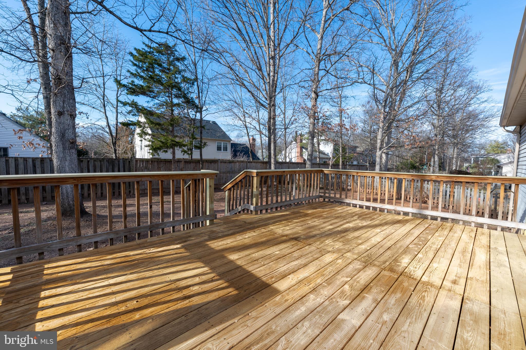 1359 Rock Chapel Road Herndon, VA 20170 - Photo 31 of 36 a view of a balcony with wooden floor and fence
