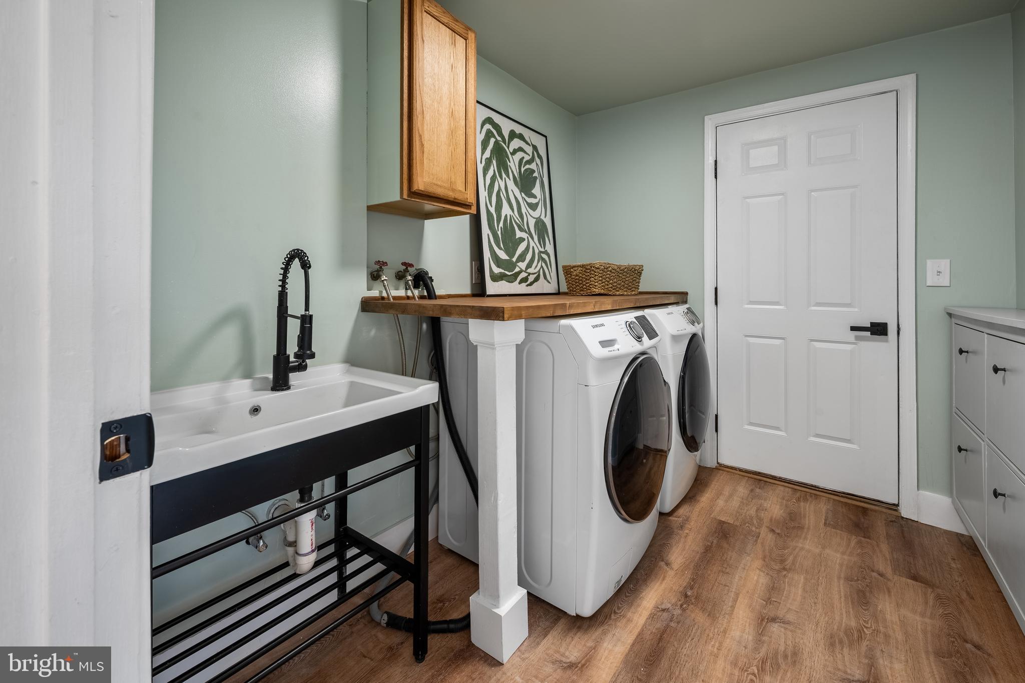 1359 Rock Chapel Road Herndon, VA 20170 - Photo 8 of 36 a utility room with sink dryer and washer