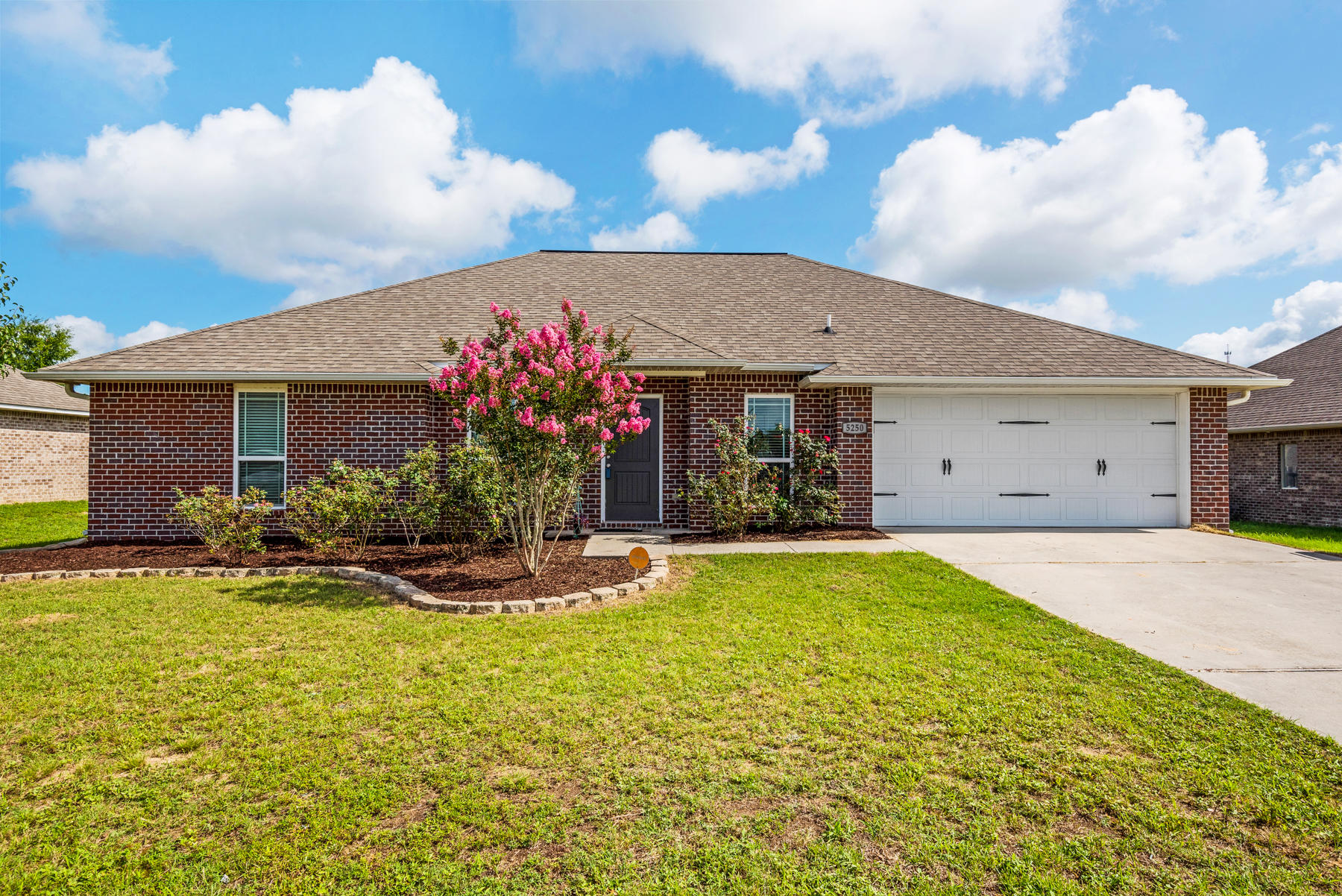 5250 Moore Loop Crestview, FL 32536 - Photo 1 of 34 a front view of house with yard outdoor seating and barbeque oven