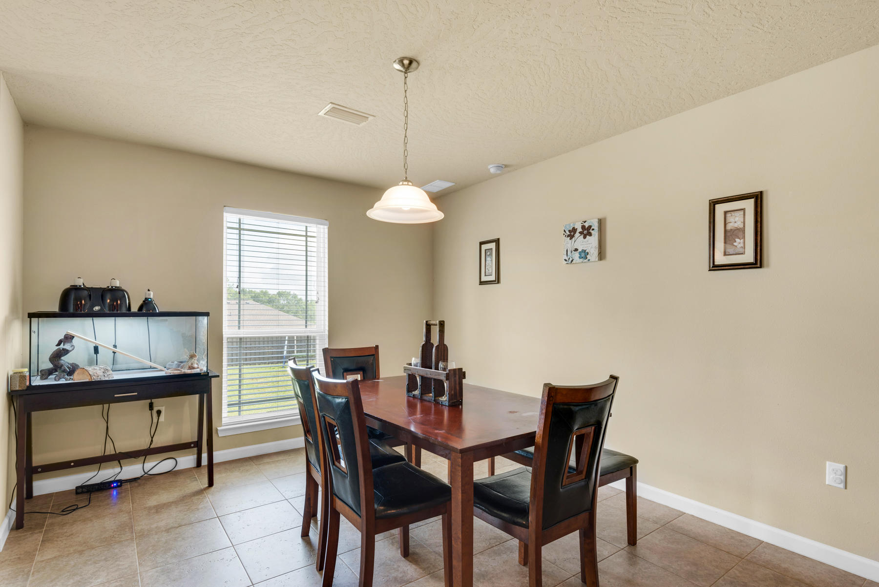5250 Moore Loop Crestview, FL 32536 - Photo 12 of 34 a view of a dining room with furniture and window
