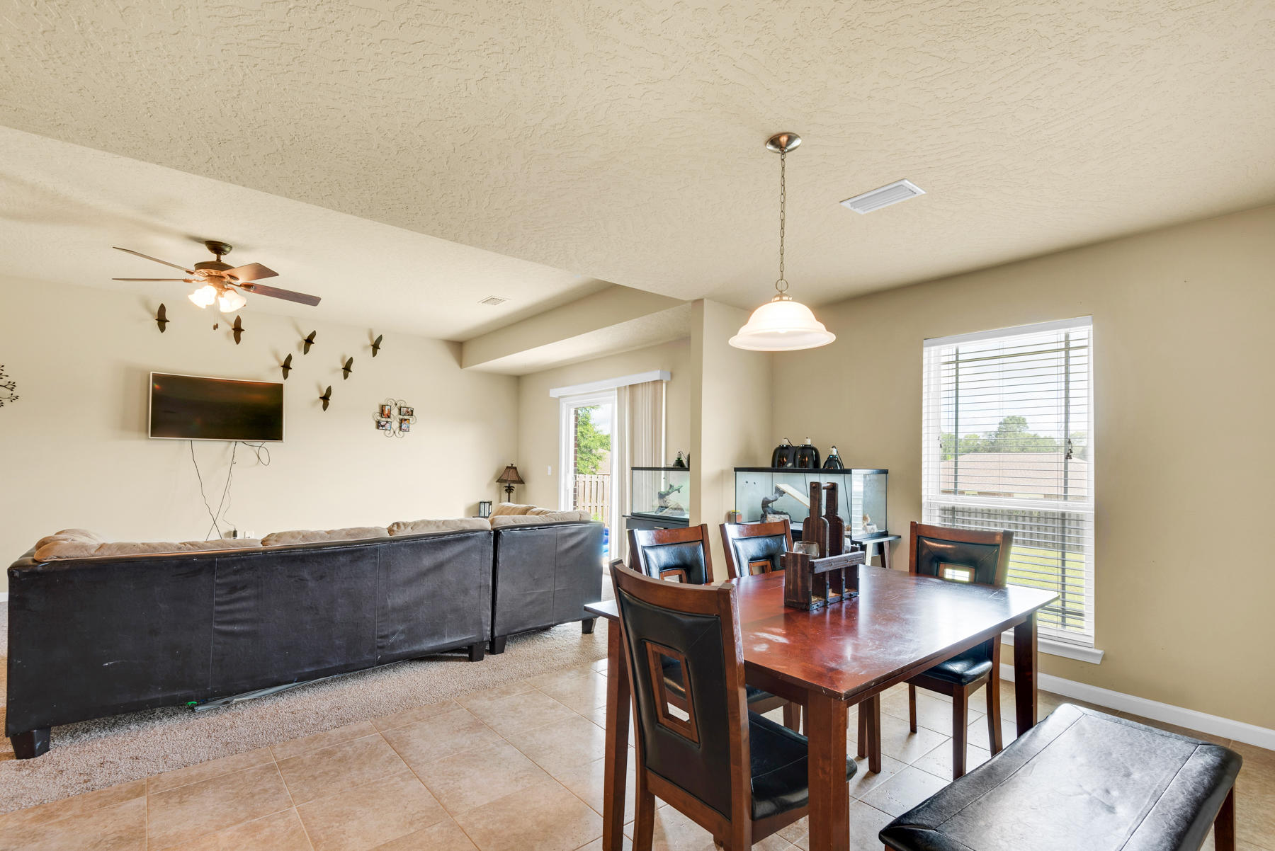 5250 Moore Loop Crestview, FL 32536 - Photo 13 of 34 a view of a dining room with furniture and wooden floor