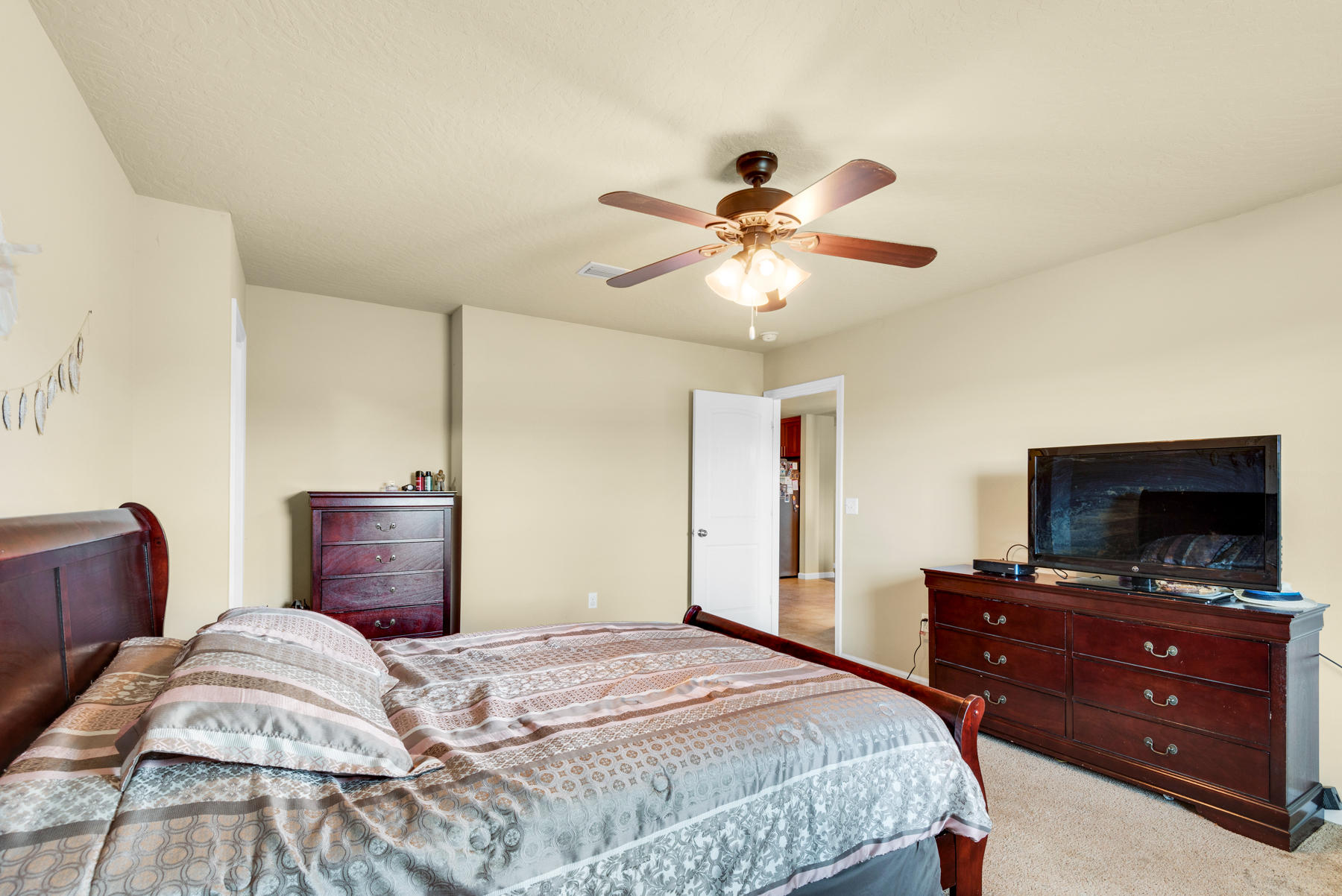 5250 Moore Loop Crestview, FL 32536 - Photo 20 of 34 a bedroom with a bed and a flat screen tv