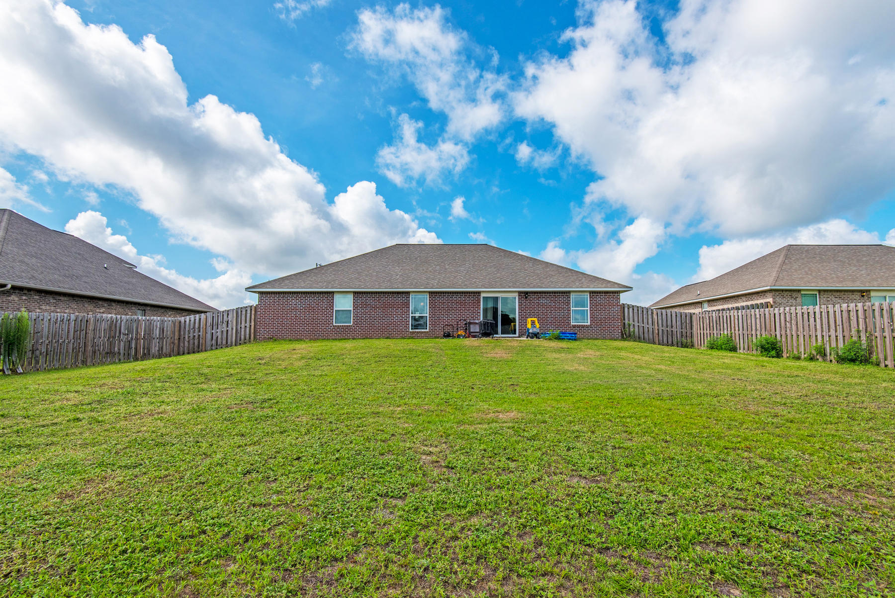 5250 Moore Loop Crestview, FL 32536 - Photo 30 of 34 a front view of a house with a yard