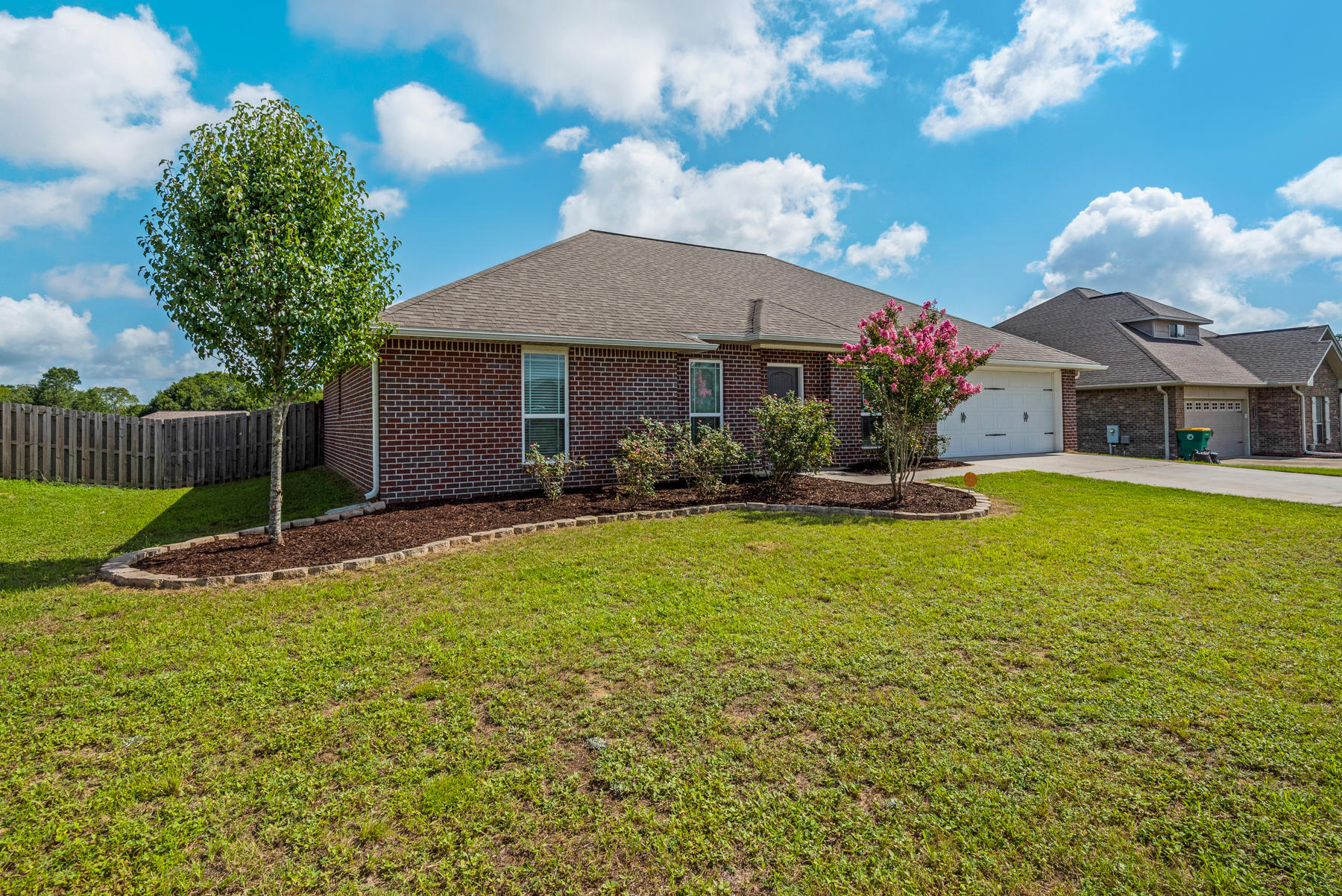 5250 Moore Loop Crestview, FL 32536 - Photo 3 of 34 a front view of a house with garden