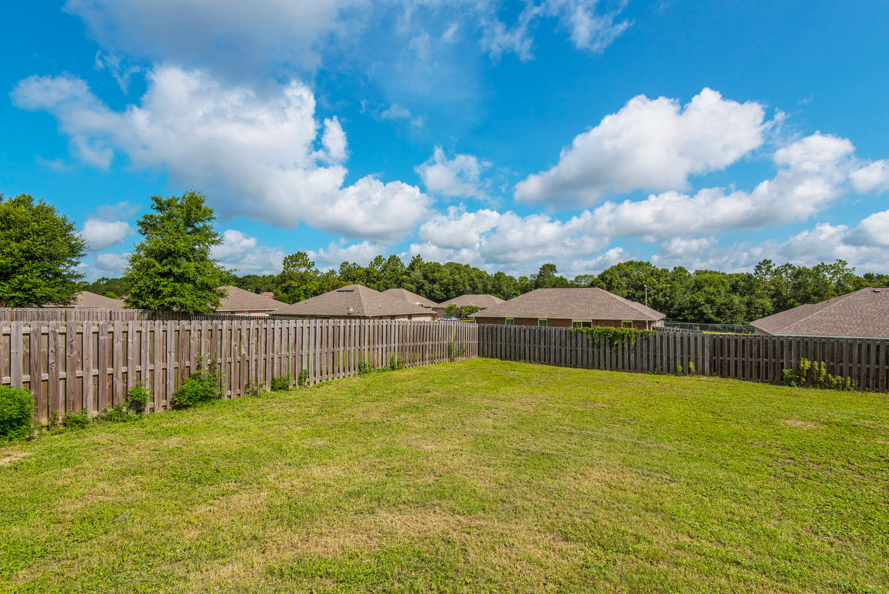 5250 Moore Loop Crestview, FL 32536 - Photo 32 of 34 a swimming pool with wooden fence