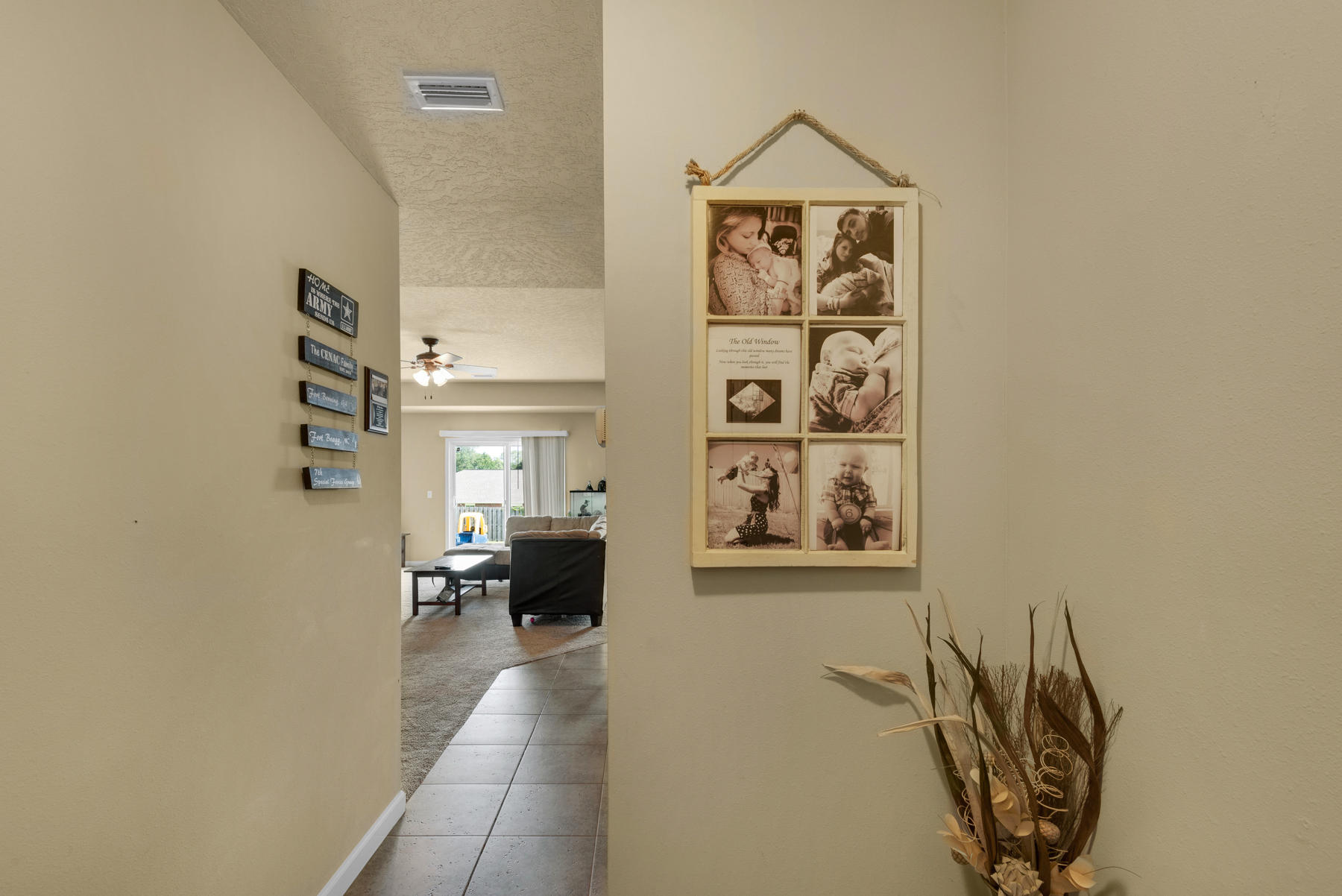 5250 Moore Loop Crestview, FL 32536 - Photo 5 of 34 a view of a hallway to a livingroom with furniture