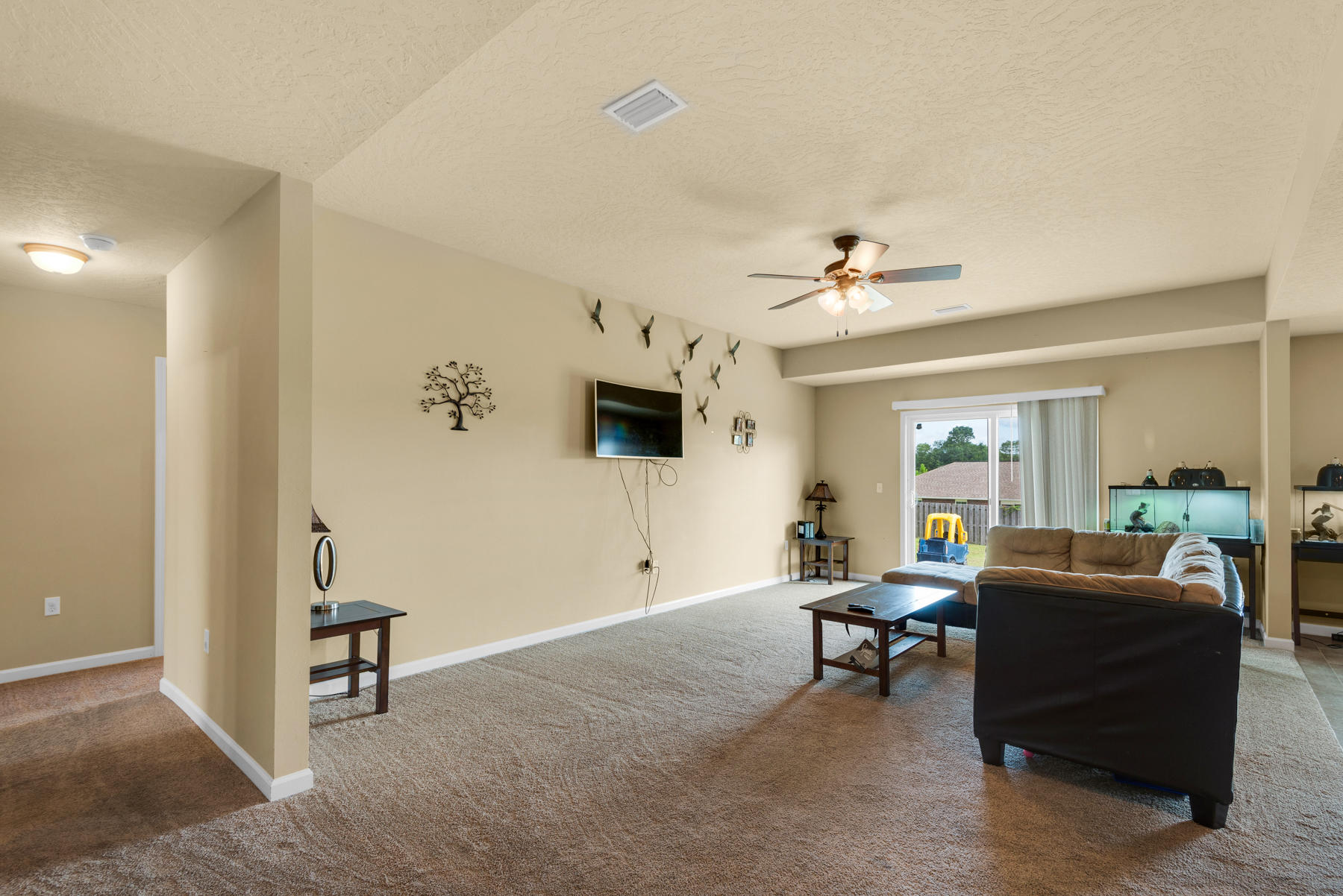 5250 Moore Loop Crestview, FL 32536 - Photo 6 of 34 a living room with furniture and a flat screen tv