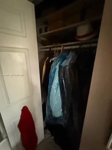 a bathroom with a sink mirror vanity and toilet