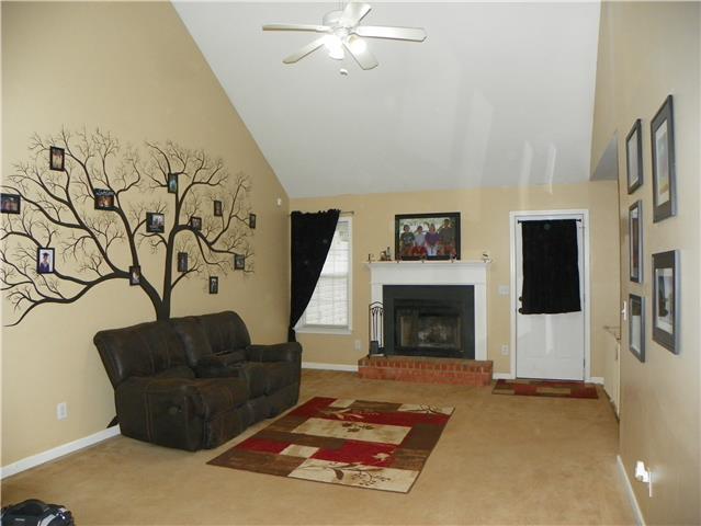 1133 Campbell Road Goodlettsville, TN 37072 - Photo 3 of 17 Large living room with vaulted ceilings and wood burning fireplace.