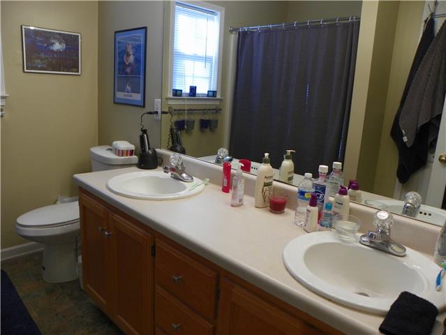 1133 Campbell Road Goodlettsville, TN 37072 - Photo 9 of 17 Master bath has double bowl vanity, tub/shower combo and a linen closet.
