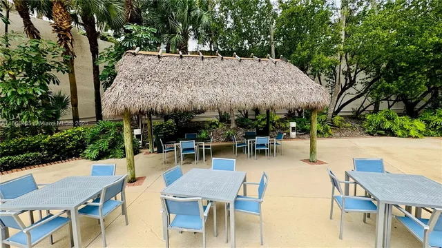 an outdoor space with patio and outdoor seating