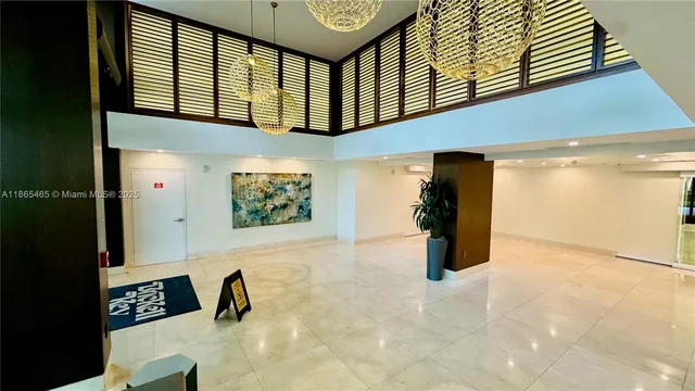 a view of a entryway door of the room