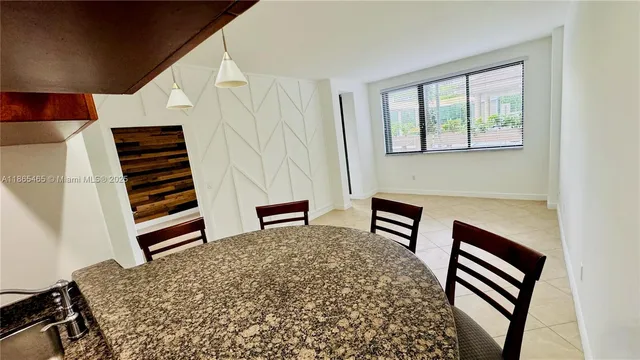 a view of a livingroom with furniture and staircase