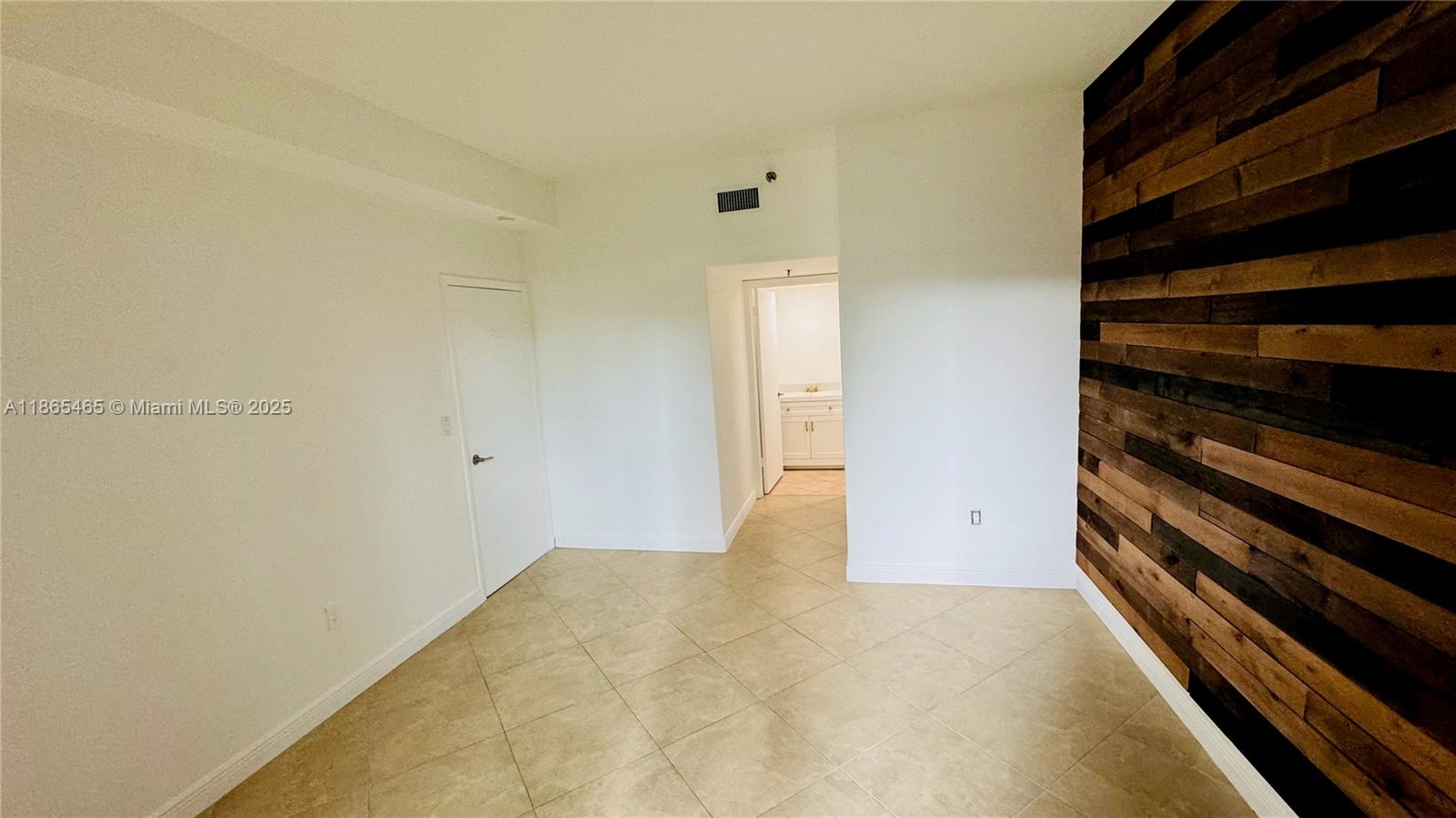 540 Brickell Key Drive, Unit 300 Miami, FL 33131 - Photo 9 of 25 a view of an empty room and wooden floor