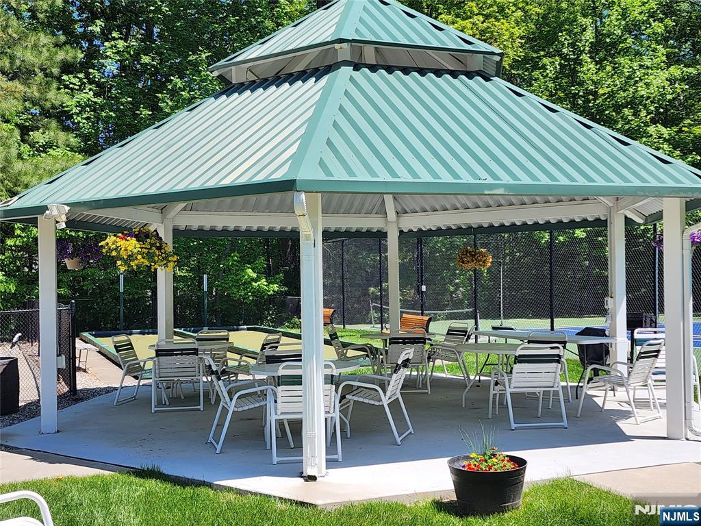 9212 Richmond Road West Milford, NJ 07480 - Photo 11 of 16 a patio with tables and chairs