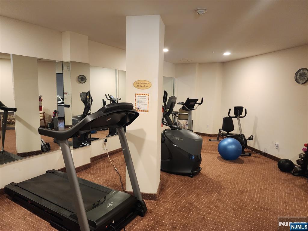 9212 Richmond Road West Milford, NJ 07480 - Photo 13 of 16 a room with gym equipment and wooden floor