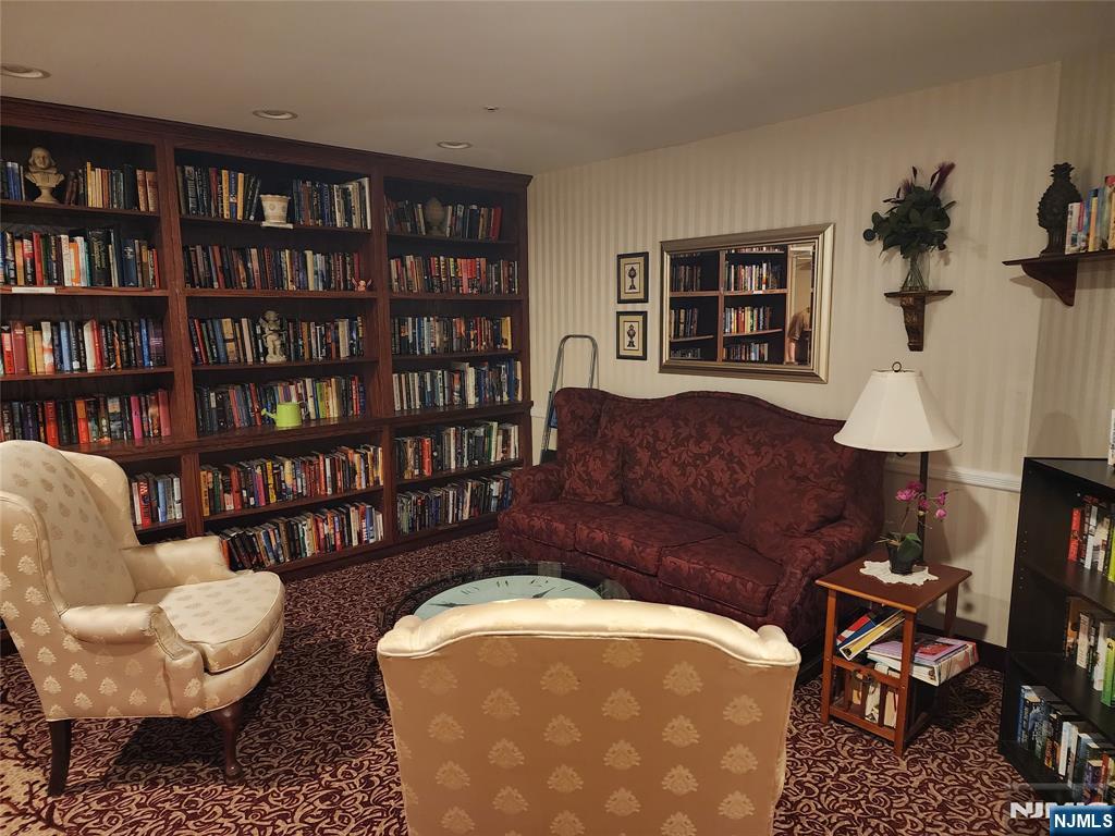 9212 Richmond Road West Milford, NJ 07480 - Photo 16 of 16 a living room with furniture and a book shelf