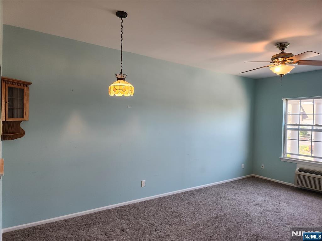 9212 Richmond Road West Milford, NJ 07480 - Photo 2 of 16 a view of a room with a ceiling fan and window