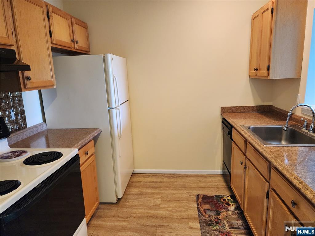 9212 Richmond Road West Milford, NJ 07480 - Photo 6 of 16 a kitchen with stainless steel appliances granite countertop a refrigerator and a sink