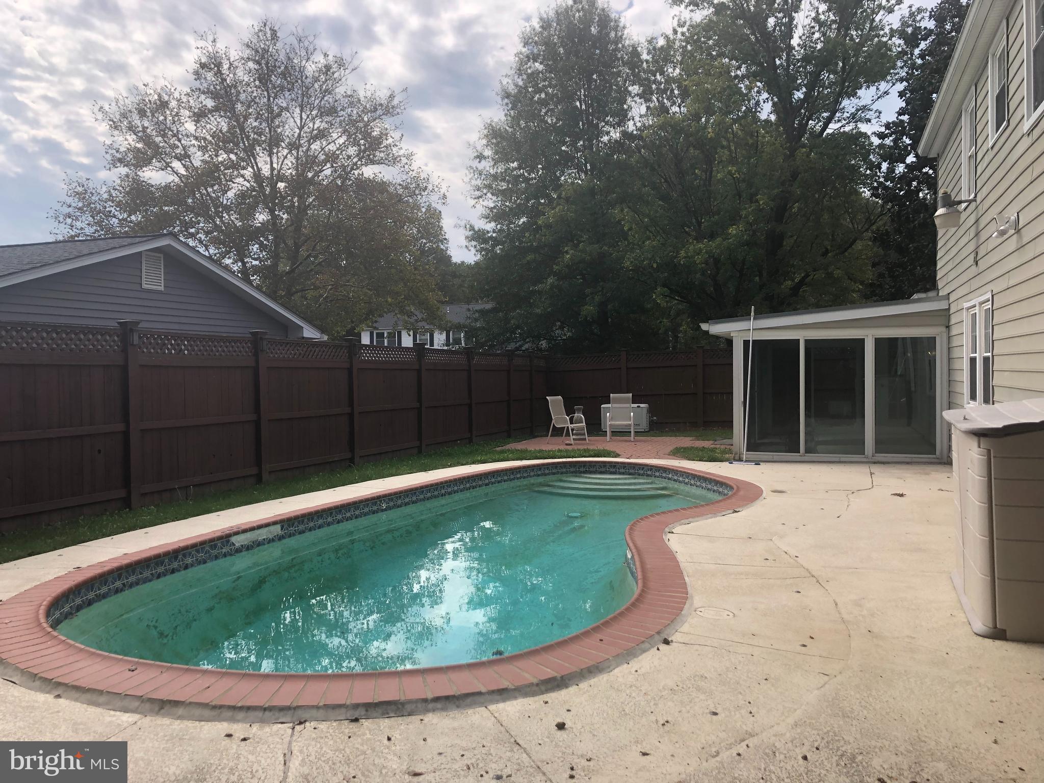 5317 Dunsmore Road Alexandria, VA 22315 - Photo 40 of 43 In ground pool, brk patio and sunroom