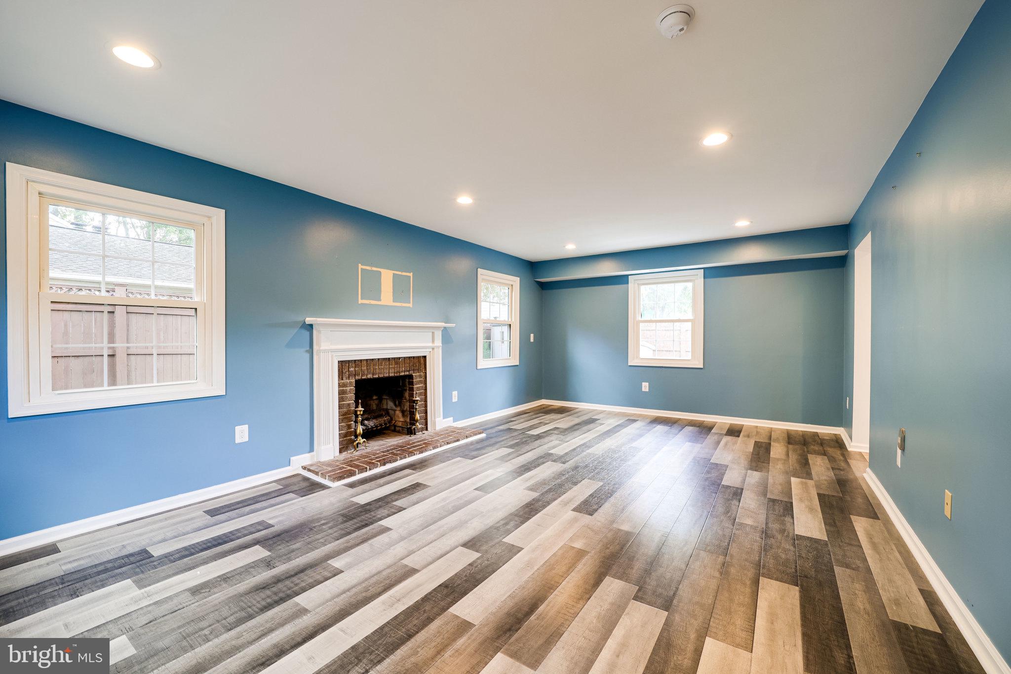 5317 Dunsmore Road Alexandria, VA 22315 - Photo 7 of 43 Large living room with wood fireplace