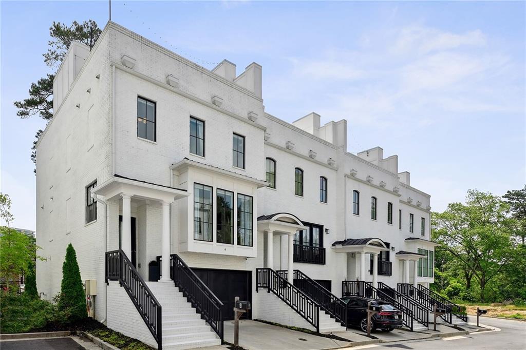 a front view of a building with many windows