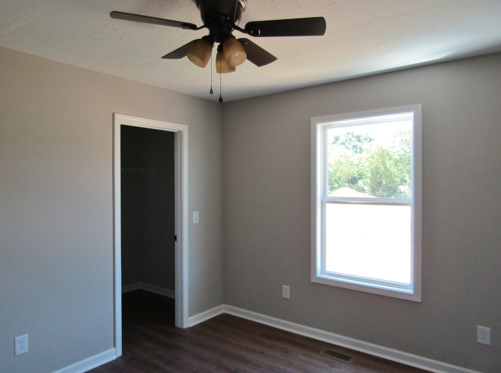 480 Crescent Factory Road Lawrenceburg, TN 38464 - Photo 14 of 14 an empty room with wooden floor closet and windows