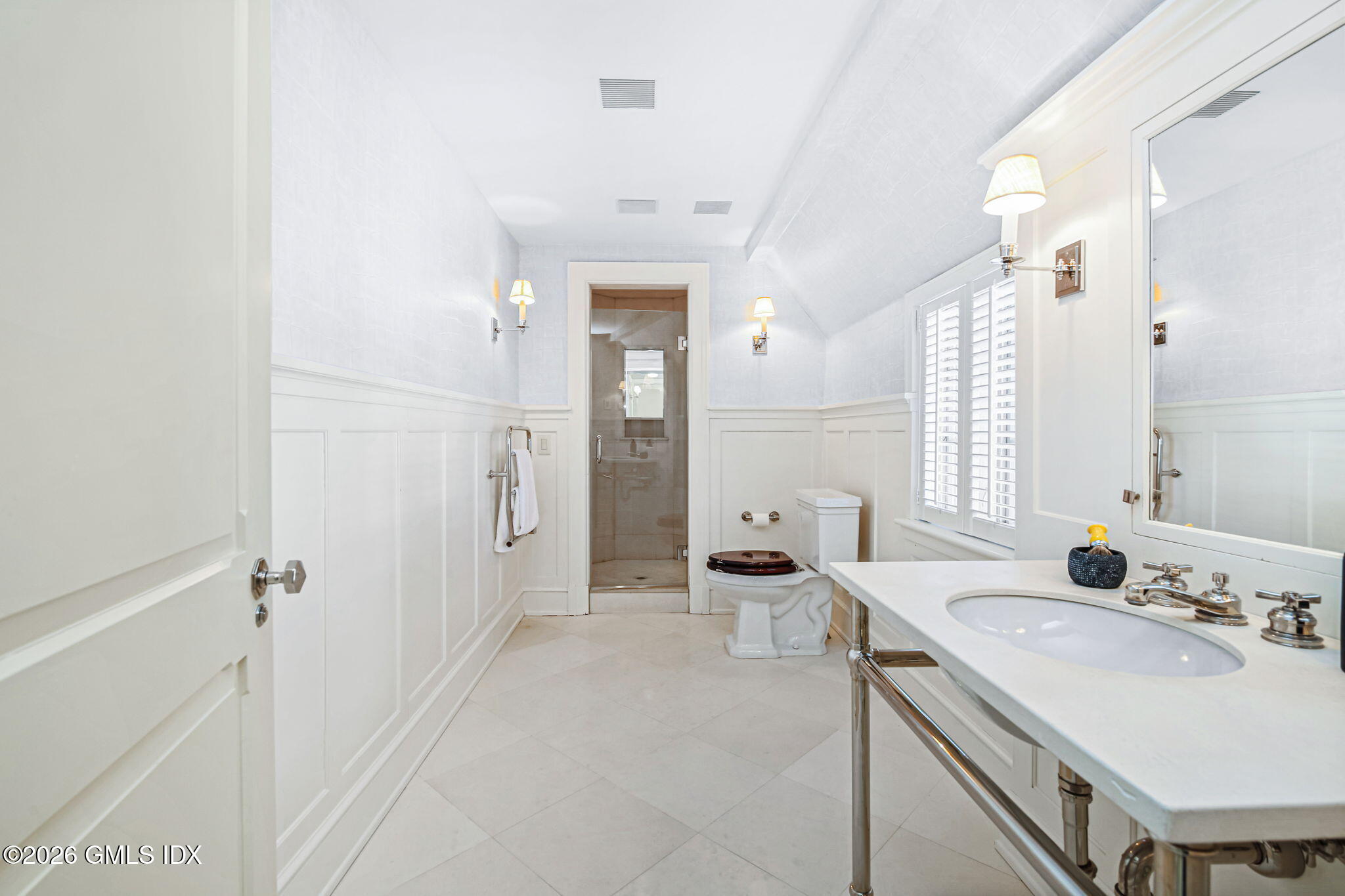 164 Round Hill Road Greenwich, CT 06831 - Photo 30 of 67 a spacious bathroom with a double vanity sink a mirror and a shower