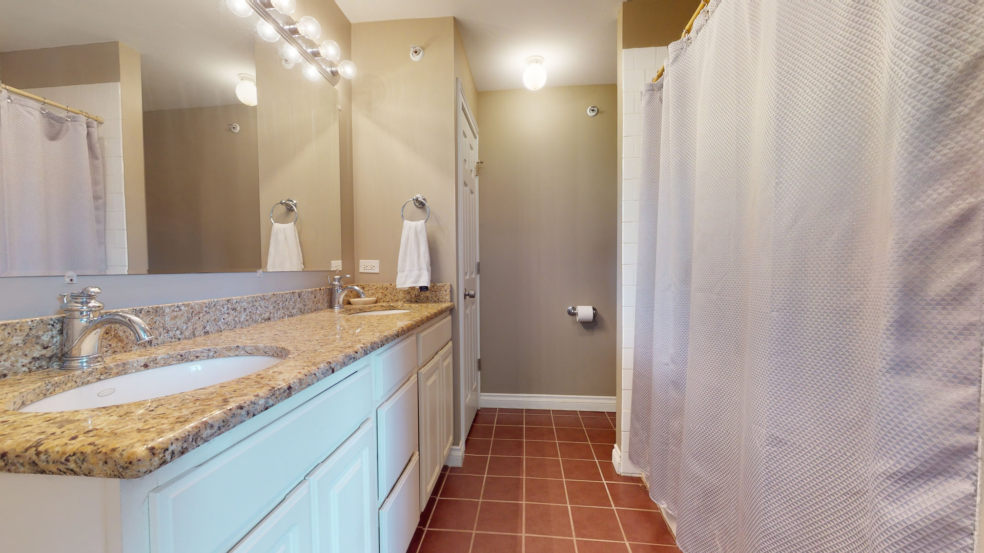 6344 Gilmer Road Long Grove, IL 60047 - Photo 24 of 43 a bathroom with a granite countertop sink a toilet and a mirror