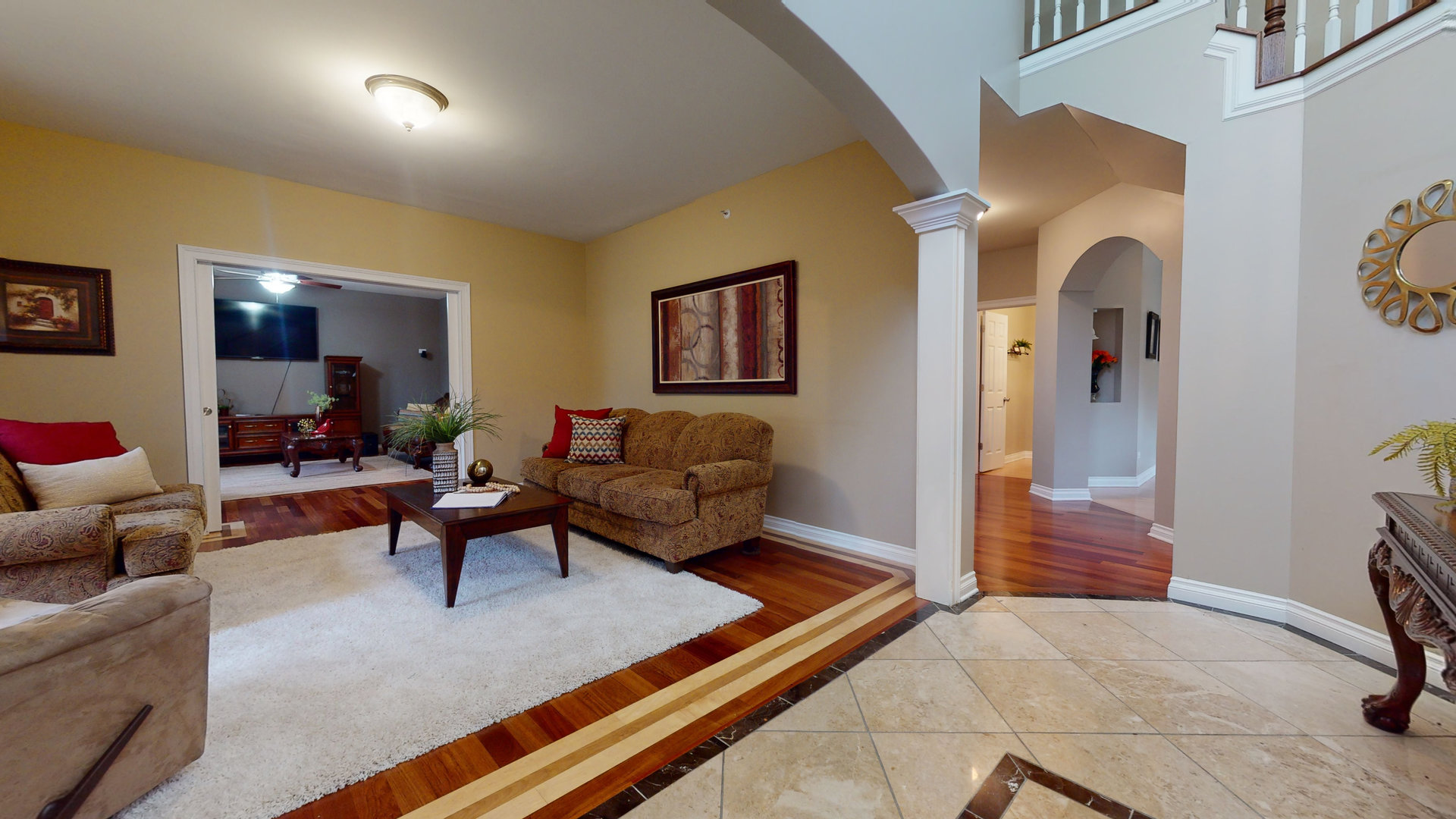 6344 Gilmer Road Long Grove, IL 60047 - Photo 5 of 43 a living room with furniture rug and wall painting