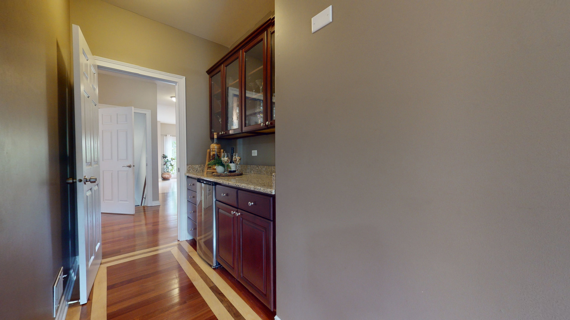 6344 Gilmer Road Long Grove, IL 60047 - Photo 9 of 43 a hallway with a sink and a refrigerator