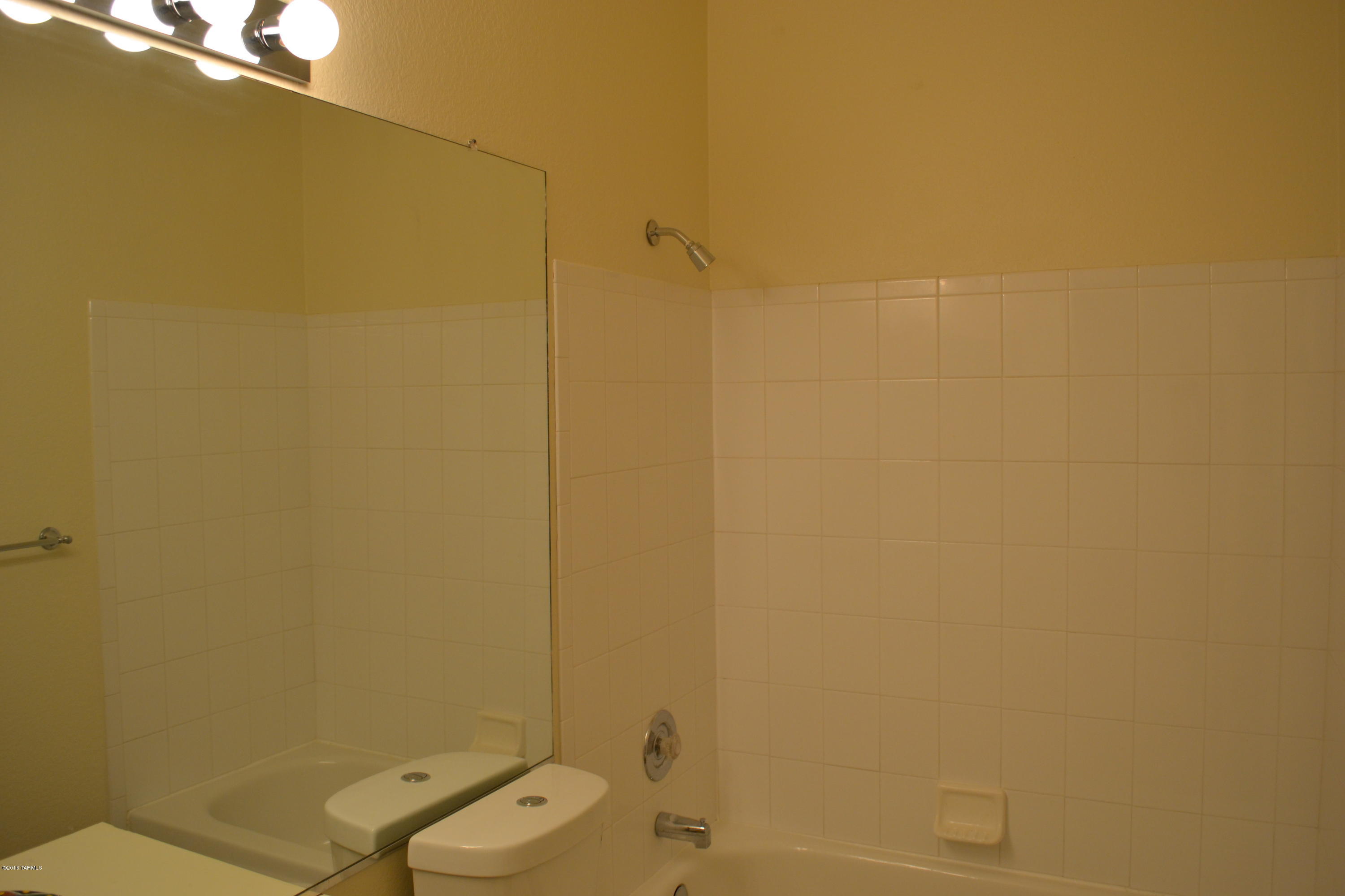 5640 North Cherokee Ridge Road Tucson, AZ 85750 - Photo 19 of 39 a bathroom with a shower and a toilet