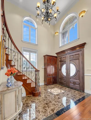 a view of an entryway with wooden floor