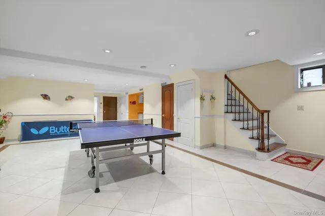 a dining room with furniture and a chandelier