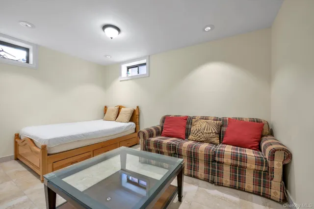 a bathroom with a sink vanity mirror and toilet