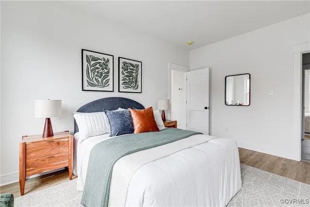 a bed room with a bed and a night stand