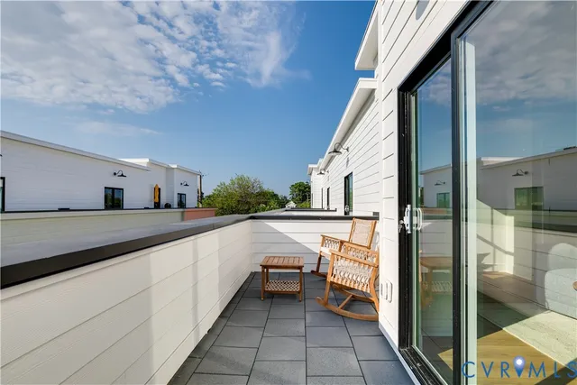 a balcony with view of living room