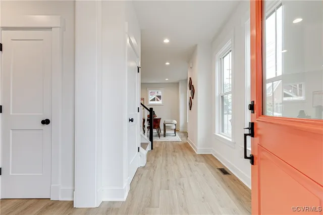 a view of a hallway with a wooden floor