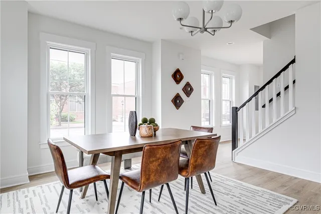 a view of a dining room with furniture window and wooden floor