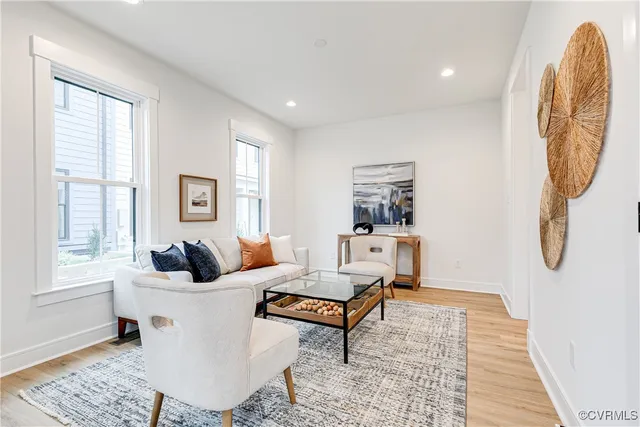 a living room with furniture and a window